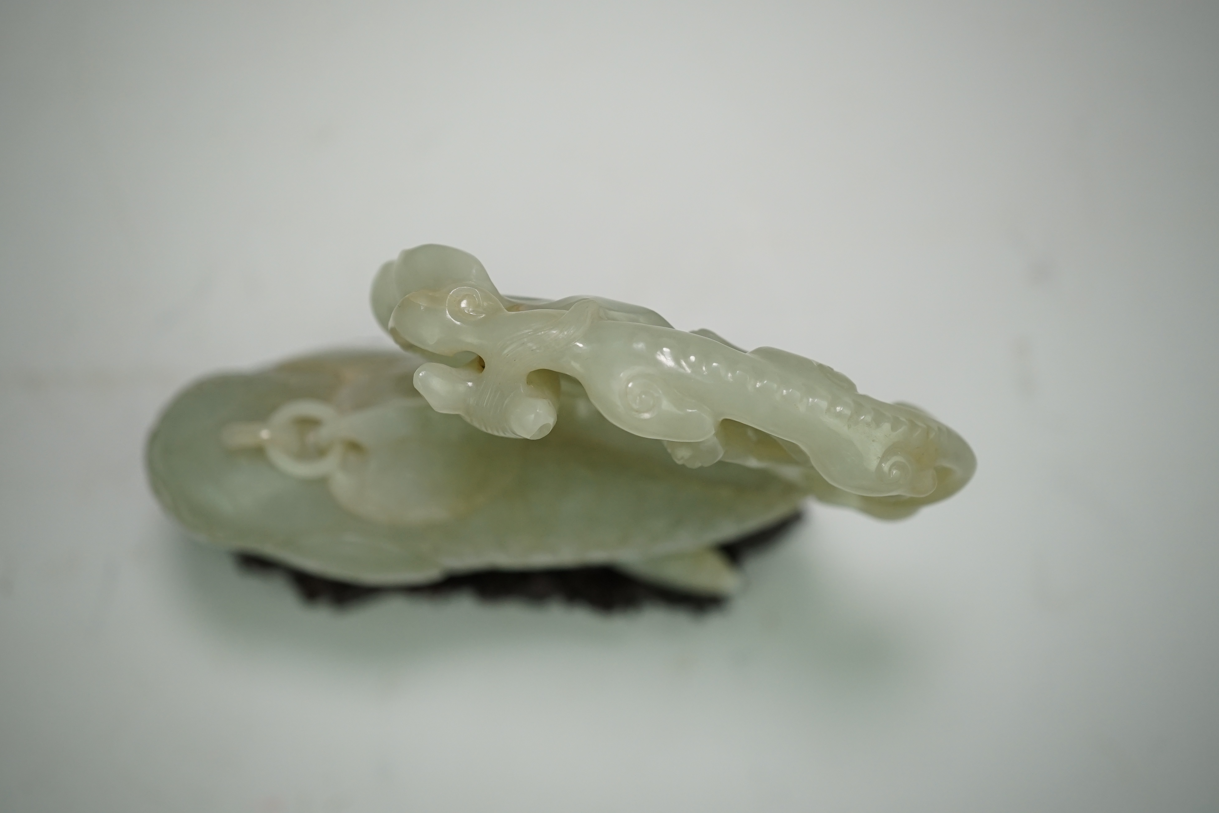 A large Chinese pale celadon jade ‘dragon-fish’ vessel and cover, 19th century